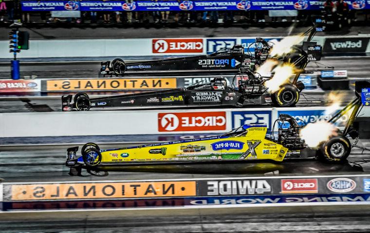 dragsters racing four-wide on track